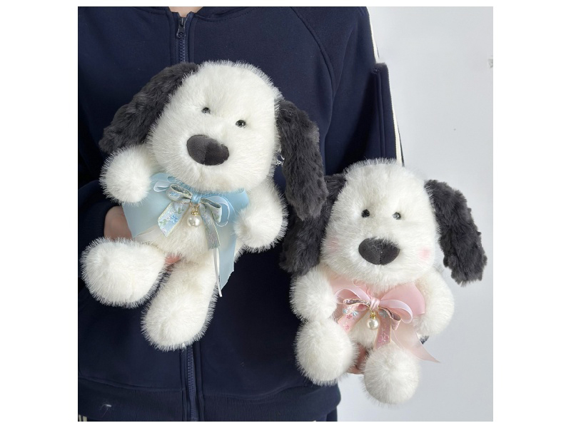 A Dog With Drooping Ears And Colorful Knots