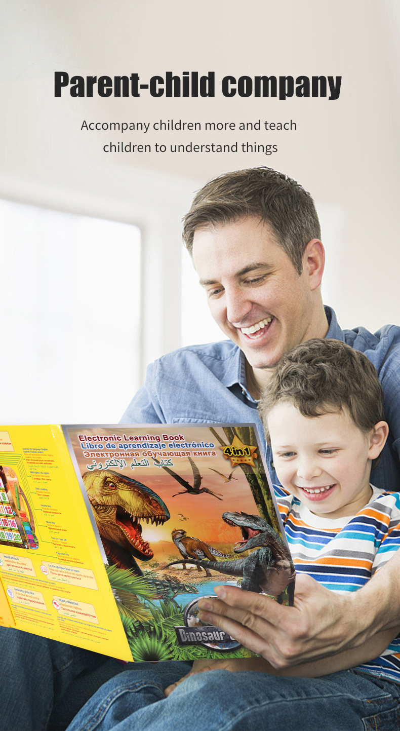Father holds boy while reading dinosaur e-book, accompanying child and teaching him to understand things