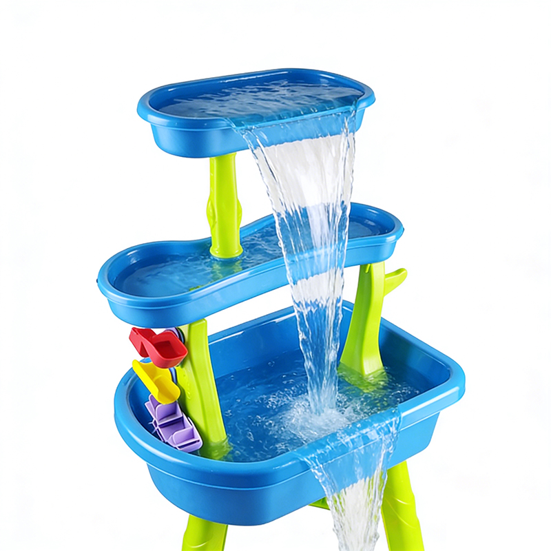 Water flows down layer by layer from the blue-green Sand & Water Table on the third floor