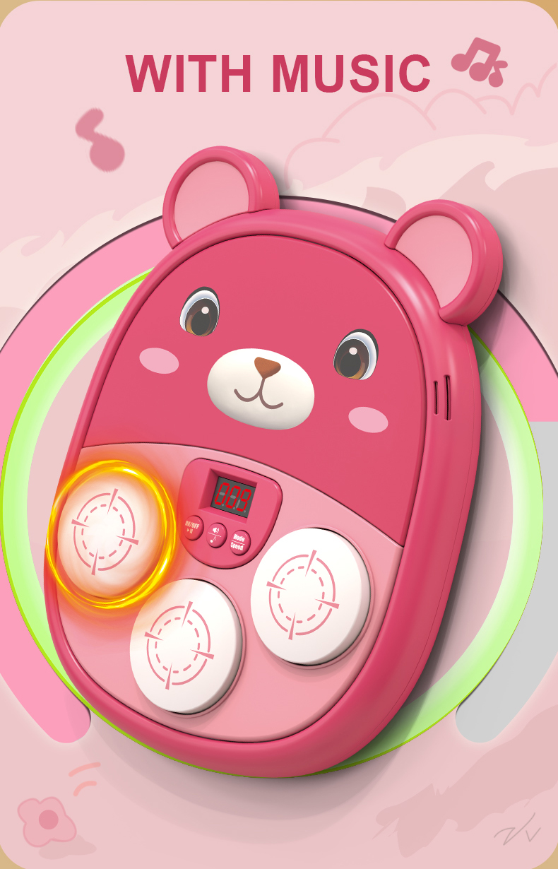 A pink bear Music Boxing Machine plays music when you press the button