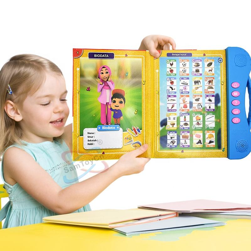 A little girl is studying at the table with her e-books