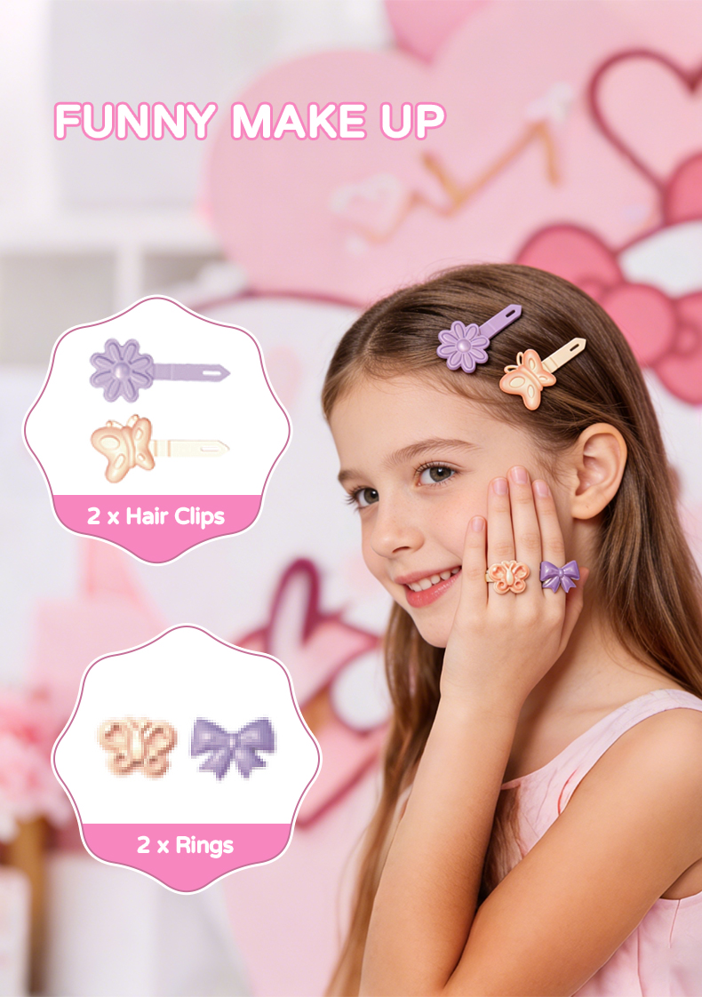 A little girl shows off the two rings on her hands and the two hair clips in her hair