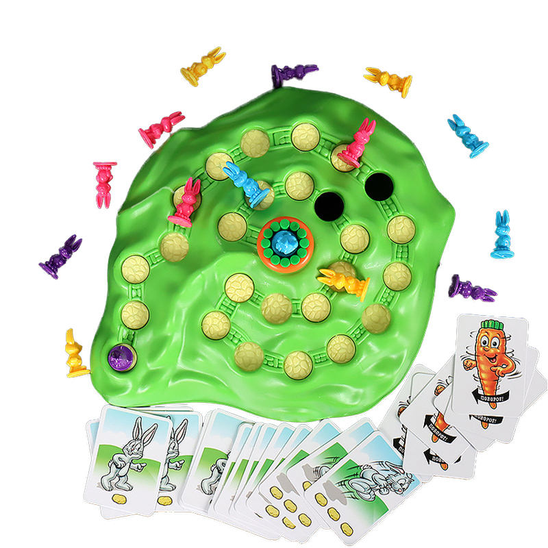 A top-down view of a puzzle rabbit off-road race toy, surrounded by numerous cards and scattered plastic toy rabbits