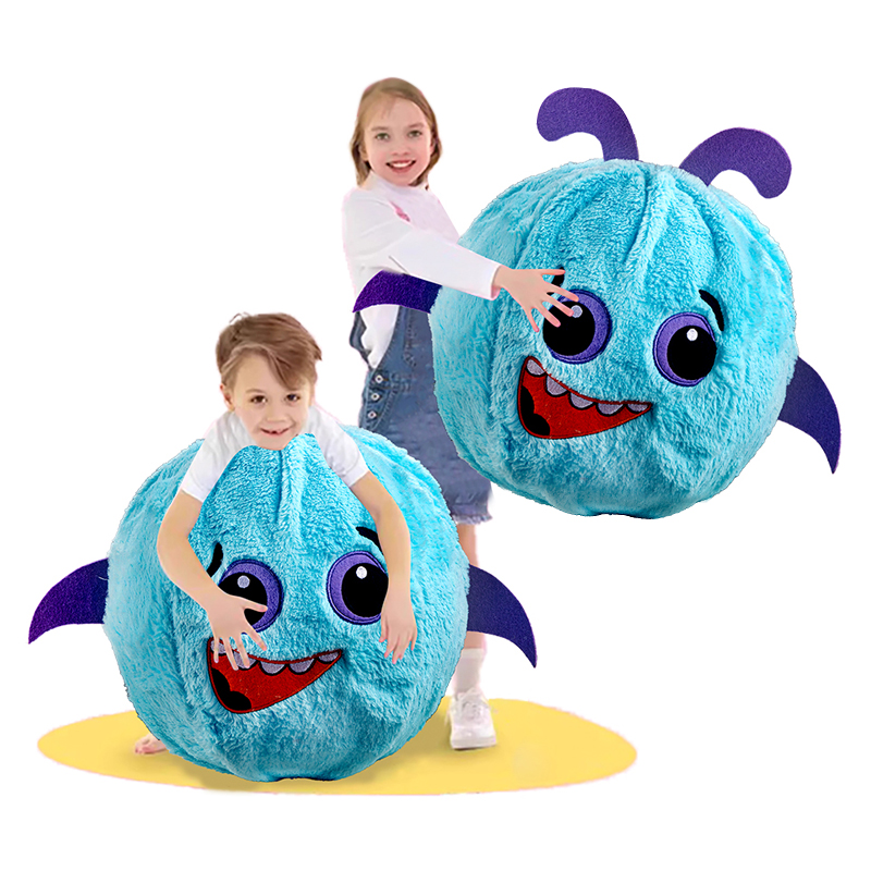 A little girl stands smiling, holding a blue Small Size Devil Plush Ball. Beside her, a little boy crouches, holding a Small Size Devil Plush Ball