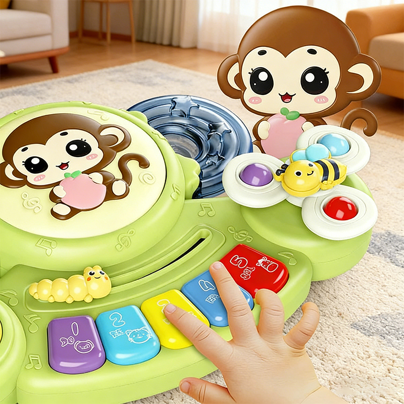 The child's hands are pressing the keys on the green Multifunctional Animal Music Piano Drum