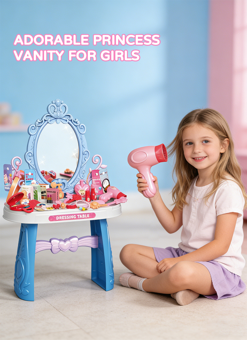 A little girl sits before a blue Princess Dressing Table Set toy, drying her hair