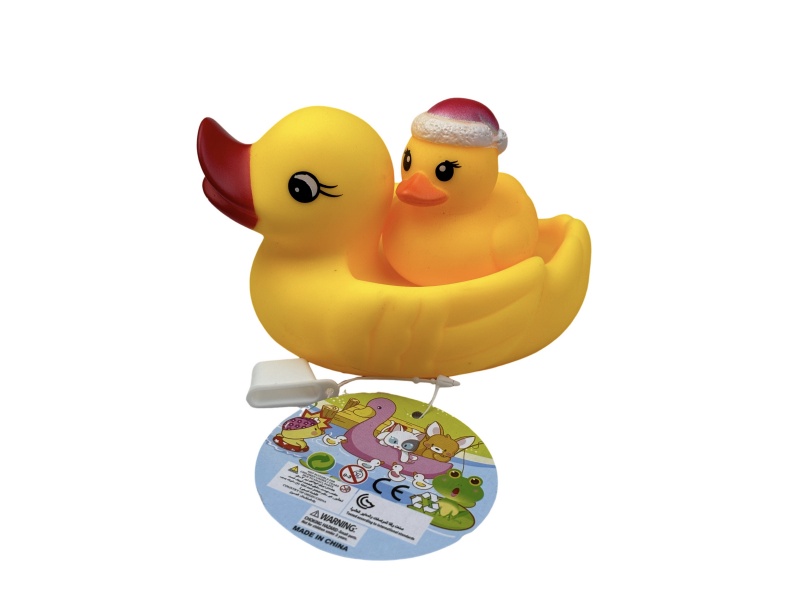 A Little Female Duck Playing In The Bathroom With A Santa Hat Duck