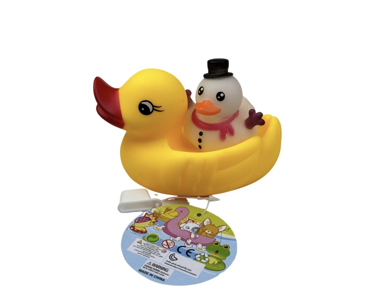 A Little Female Duck Playing In The Bathroom With A Christmas Snowman Duck