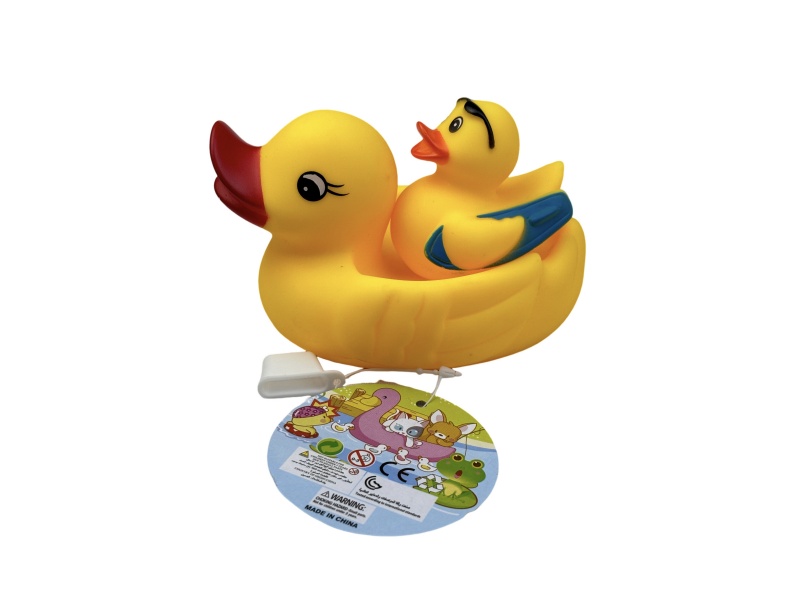 A Little Female Duck Playing In The Bathroom With A Surfing Duck