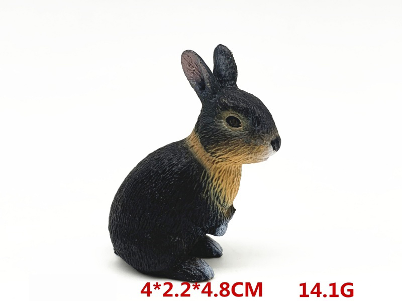 A Black And Yellow Squatting Rabbit